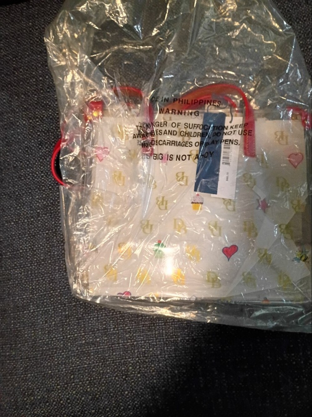 Dooney & Bourke Clear Tote with Gold DB Logo and Red Handles